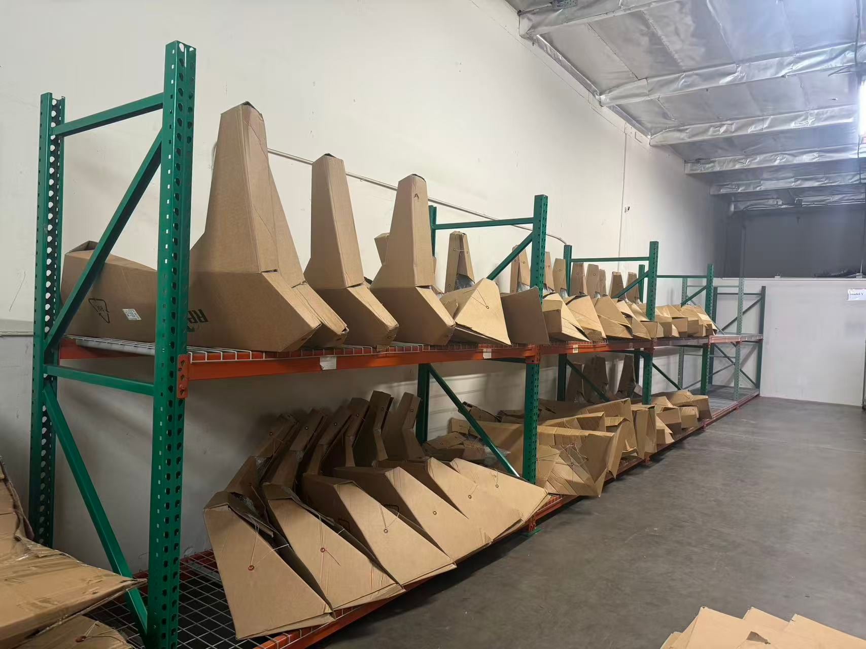 Tesla tailgate parts on warehouse rack